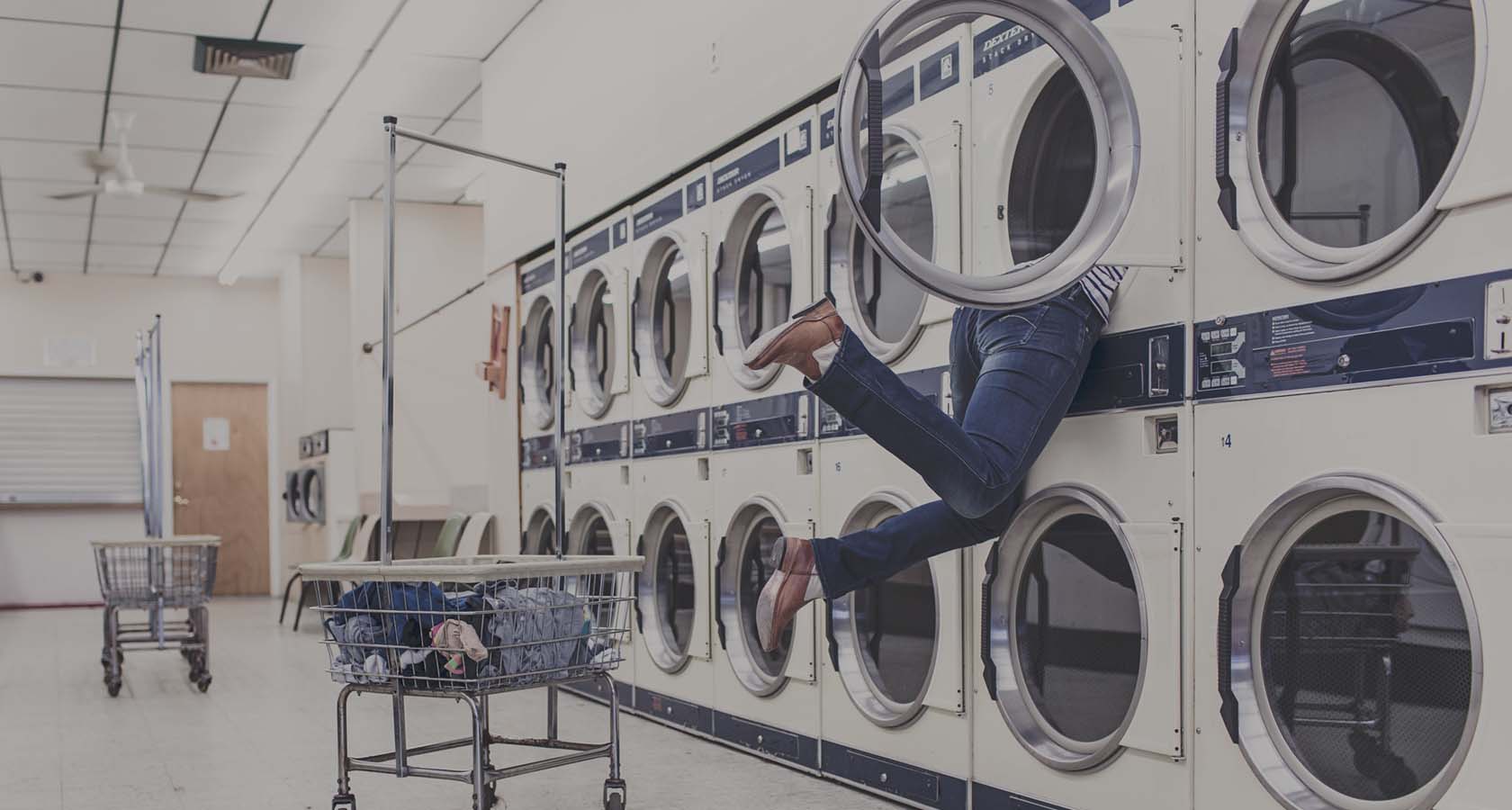 Rows of washing machines in a laundromat